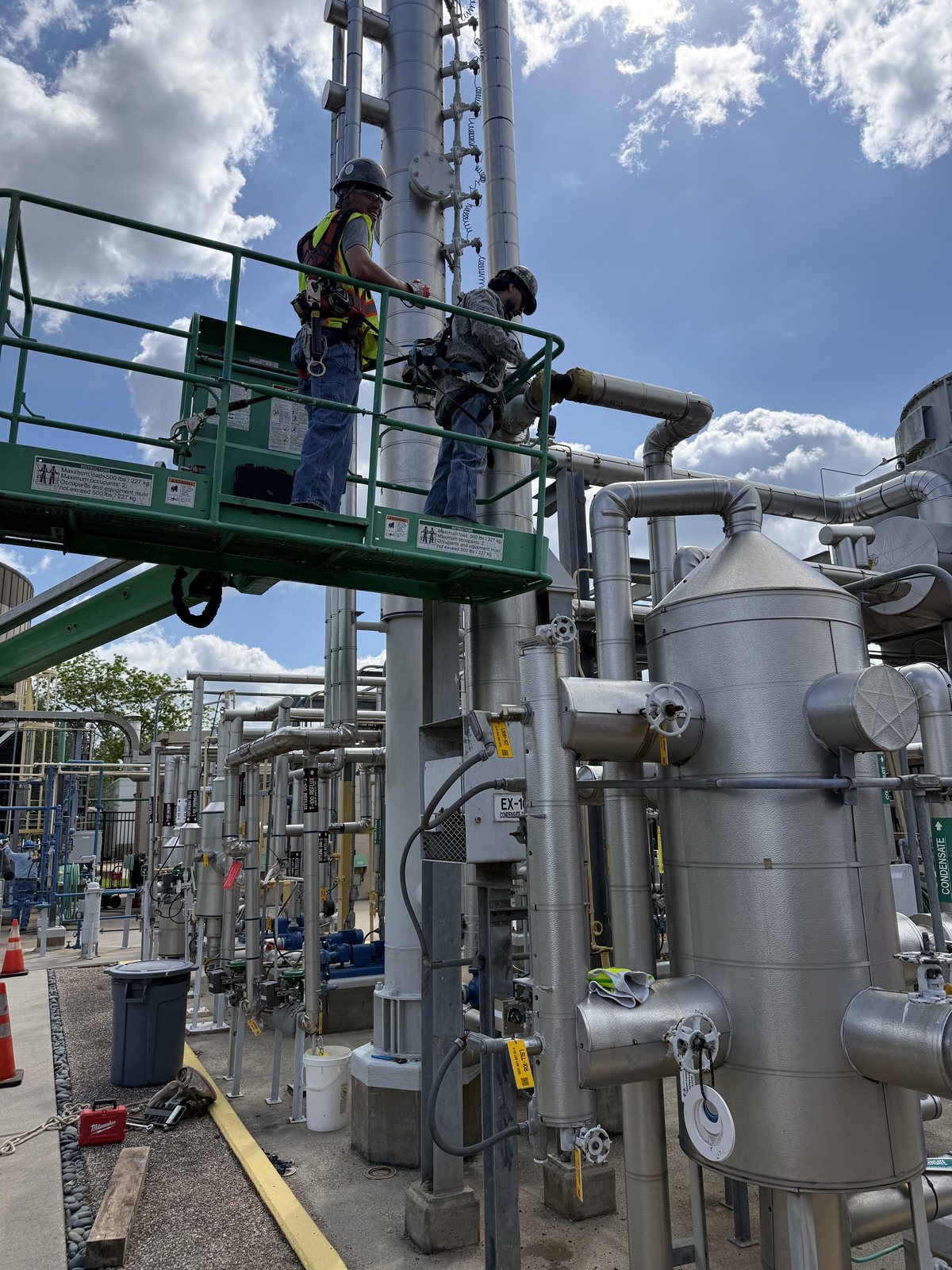 Modolith crew installing the heat exchanger from an elevated work platform
